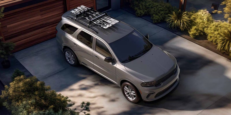 Dodge Durango SUV with roof rack carrying outdoor gear